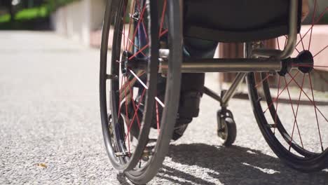 Young-disabled-person-using-wheelchair-in-slow-motion.